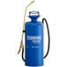 A blue metal Chapin sprayer with gold accents and a hose.
