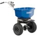 A blue Chapin salt spreader with a handle.