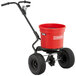 A red Chapin turf spreader with a black handle.