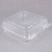 A Durable Packaging clear plastic container with a hinged lid.