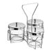 A Choice wire condiment caddy with three glass jars and metal stands on a counter.
