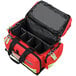 A red Kemp USA professional trauma bag with black straps and compartments.
