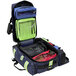 A navy blue and green backpack with a clear bag inside.