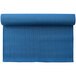 A rolled up royal blue Kemp USA yoga mat.