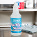 A bottle of Noble Chemical Spiffy Shine metal polish on a counter.