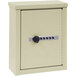 A beige Omnimed wall-mount storage cabinet with a combination lock.