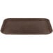 A brown Carlisle Griptite non skid rectangular serving tray.