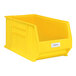 A yellow plastic bin with a Regency label holder and white label with black text.