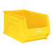 A yellow plastic bin with a white label in a Regency label holder.