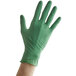 An extra-large hand wearing a green Showa nitrile glove.