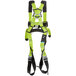 A green harness with black straps.