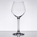 A clear Chef & Sommelier wine glass on a table with a white background.
