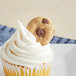 A cupcake with a Homefree gluten-free mini chocolate chip cookie on top.