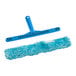 A blue mop with a T-bar handle and a brush.