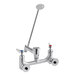 A silver T&S wall mount mop sink faucet with two long handles.