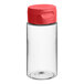 A clear plastic cylinder sauce bottle with a red lid.
