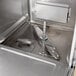 A Hobart undercounter dishwasher with a metal door.