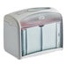 A gray rectangular Tork Xpressnap tabletop napkin dispenser with a clear lid.
