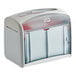 A gray rectangular Tork Xpressnap tabletop napkin dispenser with a clear lid.