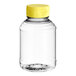 A clear plastic 8 oz. Skep honey bottle with a yellow cap.