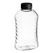 A clear plastic ribbed hourglass honey bottle with a black cap.