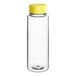 A clear plastic cylinder sauce bottle with a yellow cap.