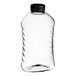 A clear plastic ribbed honey bottle with a black flip top lid.