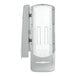 A gray Tork Xpressnap standing / wall mount napkin dispenser with a white plastic door.