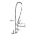 A silver T&S wall mount pre-rinse faucet with a hose.