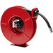 A red Reelcraft hose reel with a black hose attached.