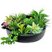 An artificial succulent garden in a black ceramic bowl.