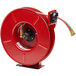 A red Reelcraft hose reel with green and red hoses.