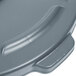 A close up of a gray Rubbermaid Brute 55 gallon trash can lid.