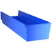 A blue plastic Regency shelf bin with compartments.
