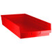 A red plastic Regency shelf bin.