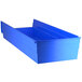 A blue plastic Regency shelf bin with open compartments.