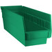 A green plastic bin for shelves with two compartments.