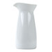An Arcoroc white ceramic creamer with a lid on a white background.