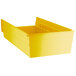 A yellow Regency plastic shelf bin with two compartments.