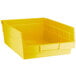 A yellow Regency plastic shelf bin with a handle.
