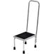 A Vestil stainless steel step stool with a hand rail.
