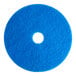 A blue Lavex Basics circular floor cleaning pad with a hole in the middle.