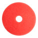 A red circular Lavex Basics floor machine pad with a hole in the middle.