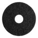 A black circular Lavex Basics stripping floor machine pad.