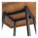 The black metal base of a Lancaster Table & Seating bar height table.