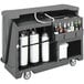 A granite gray Cambro portable bar with bottles on it.