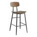 A Lancaster Table & Seating barstool with a wood seat and backrest.
