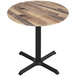 A Holland Bar Stool EuroSlim round table with a wooden surface and black metal legs.