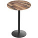A Holland Bar Stool EuroSlim round wooden table with a black round base.