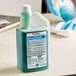 A bottle of SC Johnson Professional Quaternary Disinfectant Cleaner on a counter.